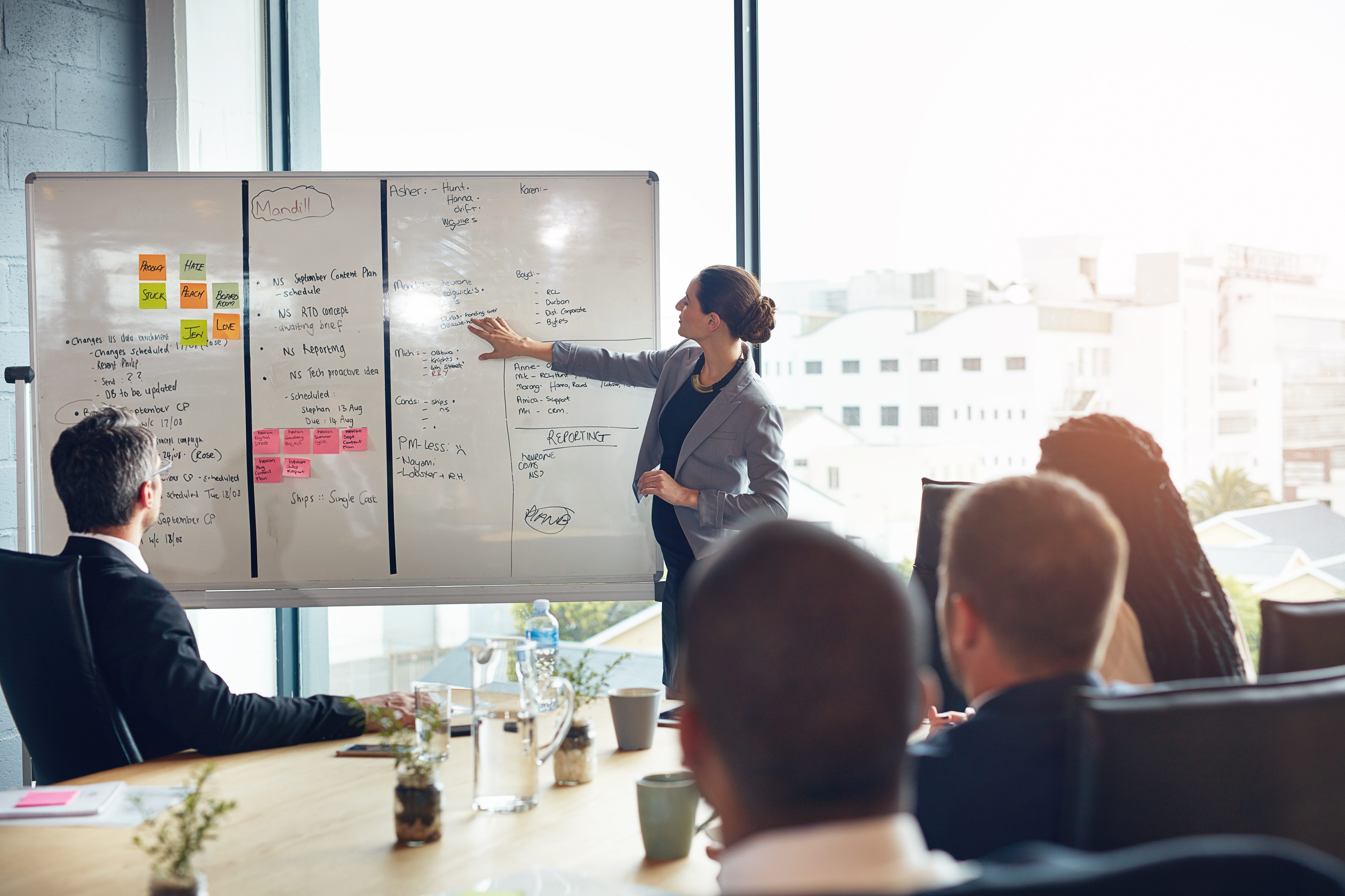 Office workers at their desks, the headcount that per-seat software is priced against